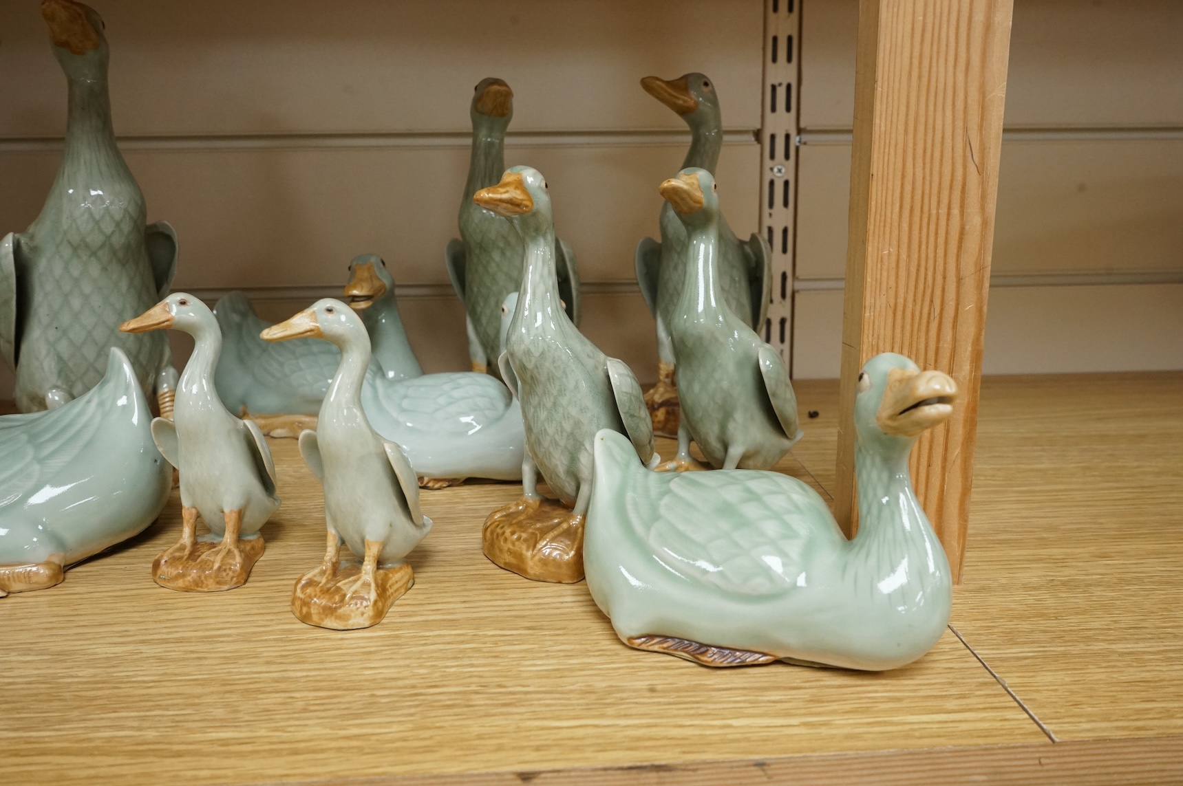 A collection of Chinese celadon glazed models of geese and ducks, largest 31cm high
